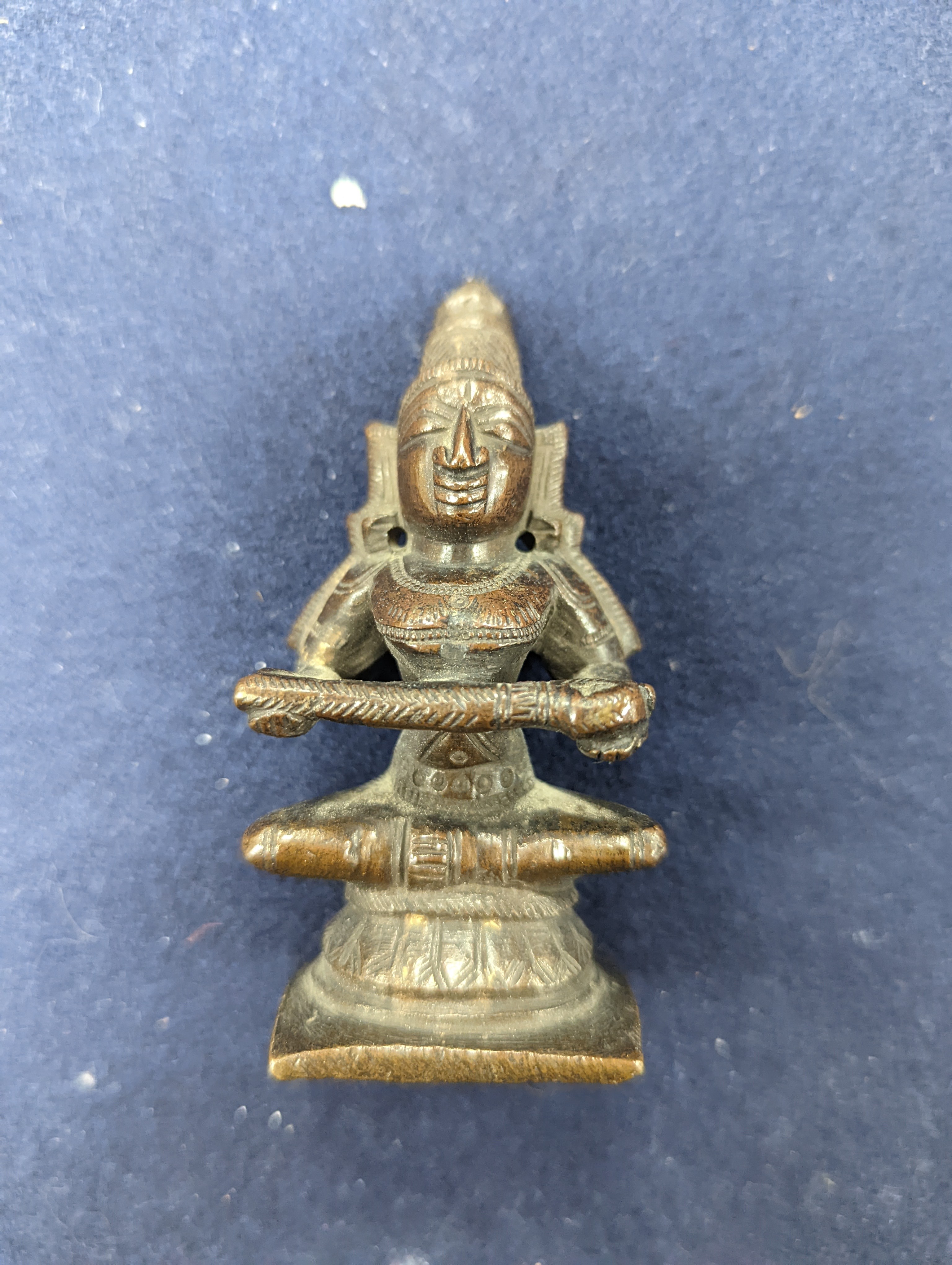 A Chinese gilt copper figure, a Chinese Dog of Fo, a bell, a censer, six Indian bronze figures and a scroll box